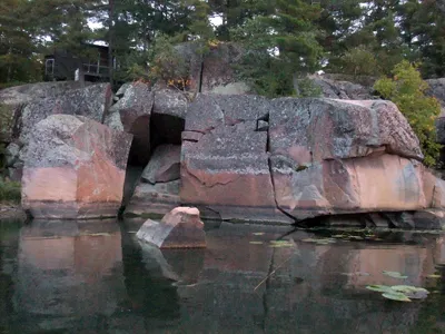Rusty's Cabin on pink granite shoreline