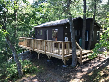 Rusty's Cabin on pink granite shoreline overlooking Georgian Bay near Killarney Provincial Park